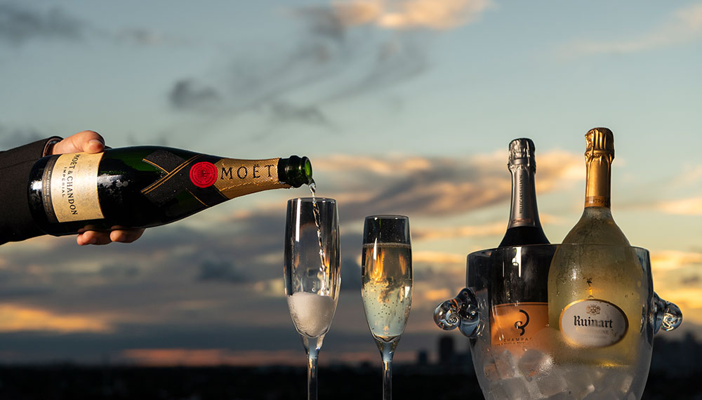 Wine being poured during sunset