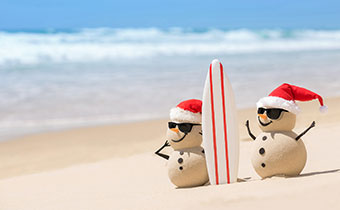 Sandy snow men on the beach